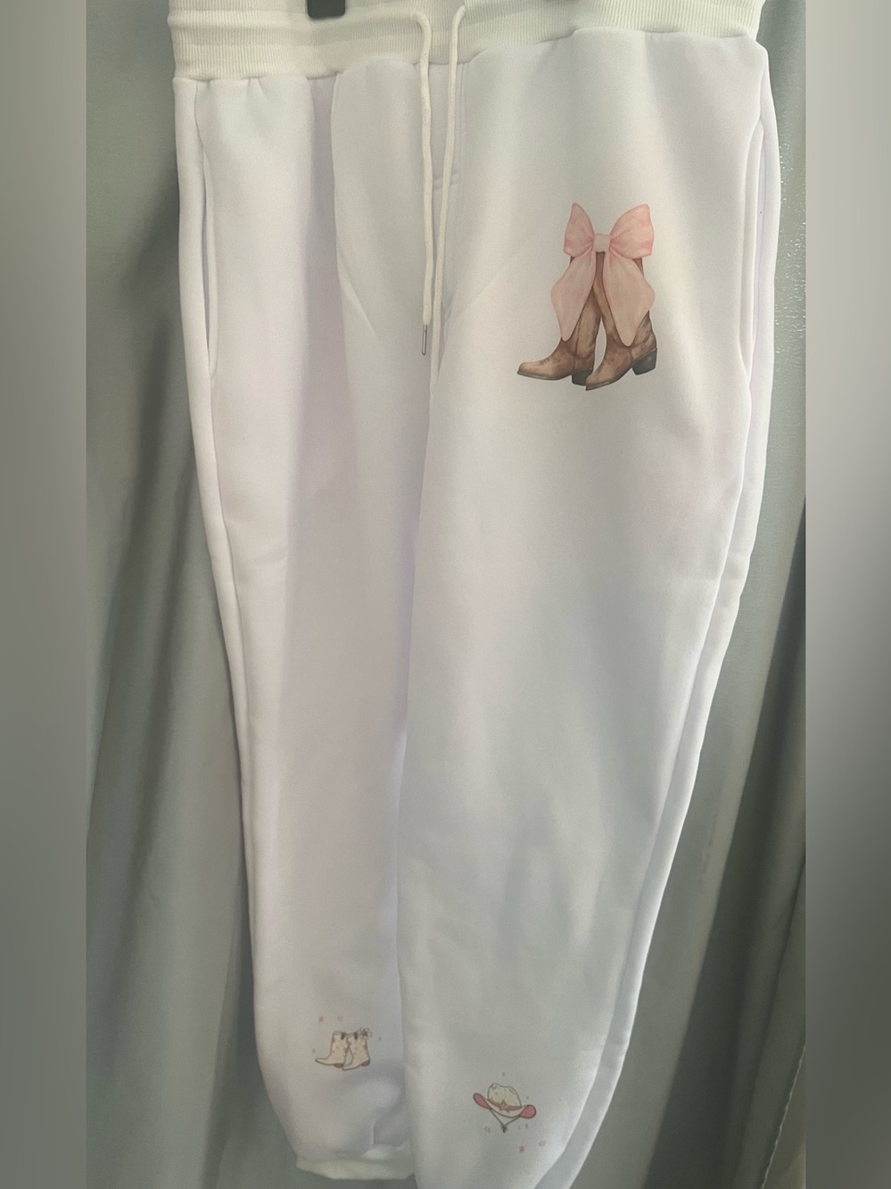 White Women's Jumpsuit with Pink Bow & Boot Graphic